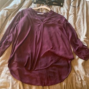 Purple three quarter sleeve v neck blouse